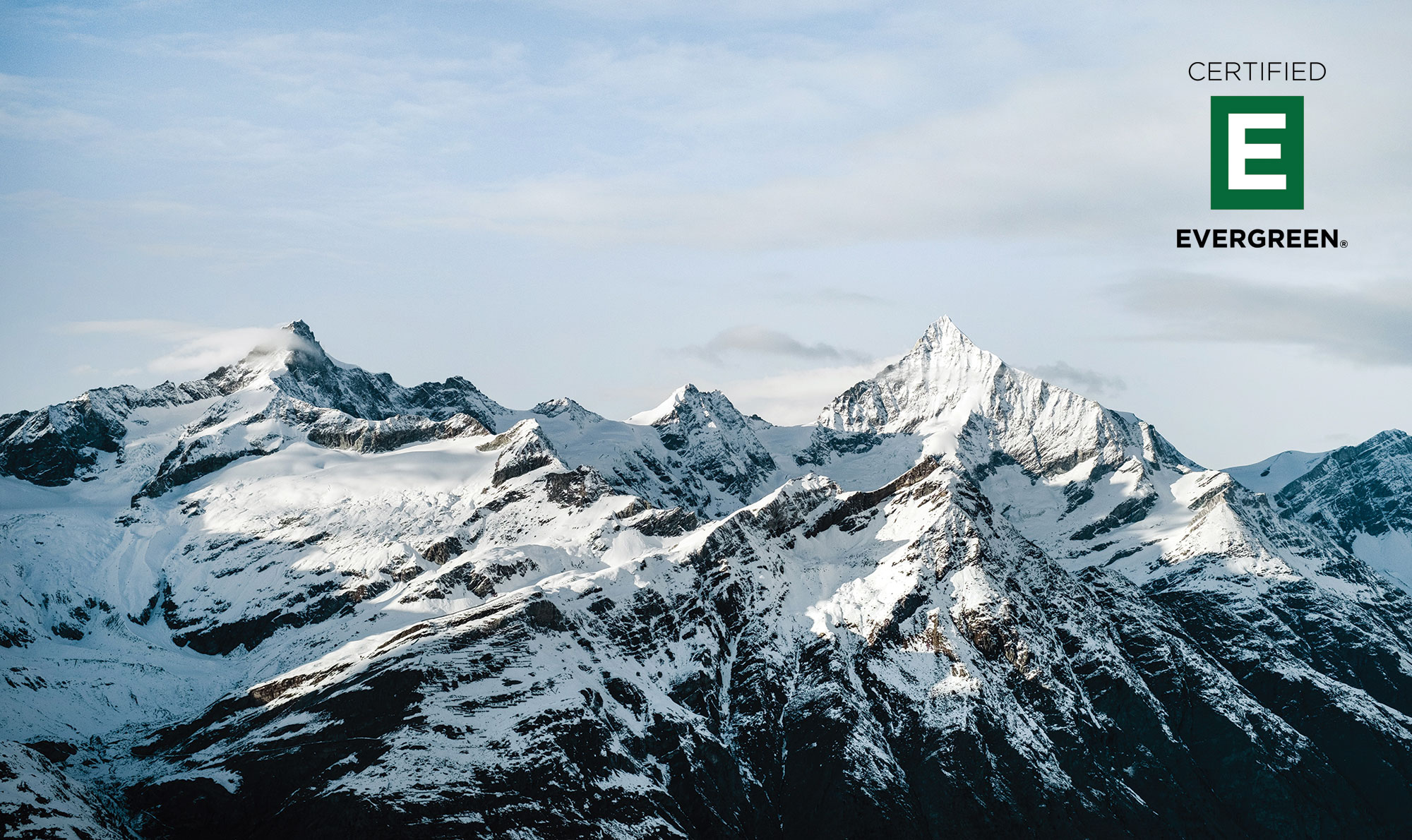 Mountain horizon with Certified Evergreen logo